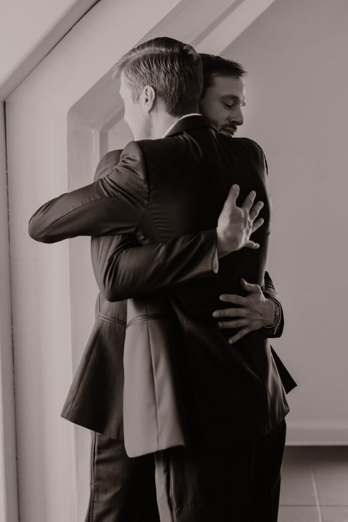 groom hugging brother
